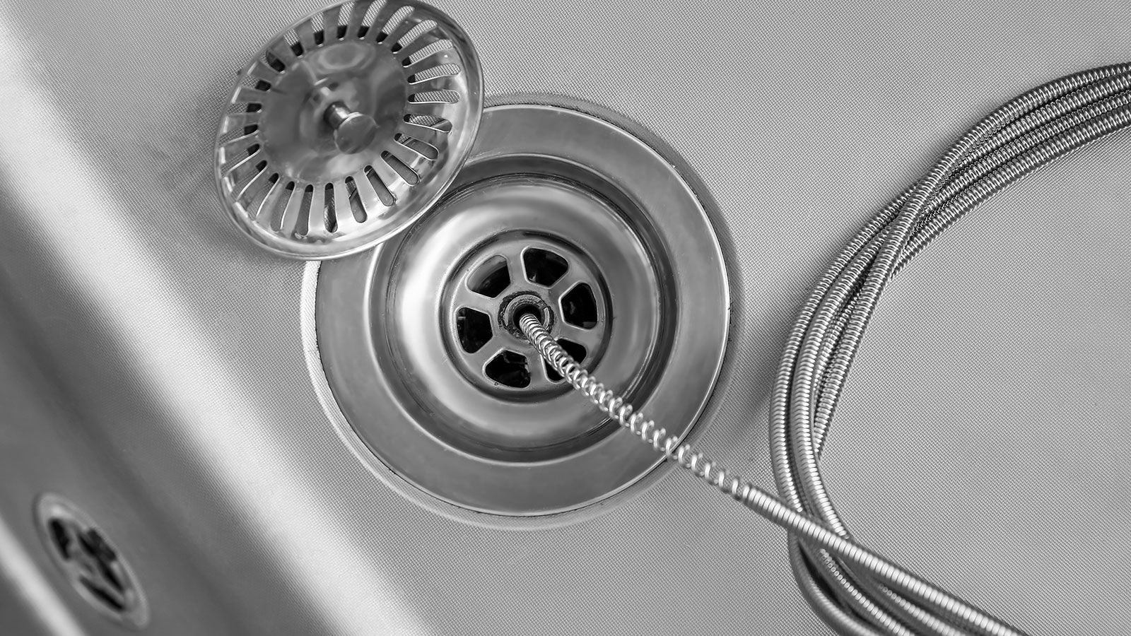 Kitchen sink drain being cleared